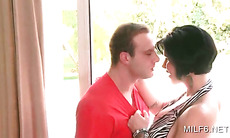 Sassy sex starved MILF flashing assets and fucking teen guy