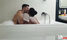 couple fucking in a bathtub